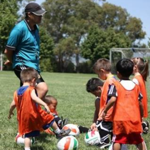 kids learning soccer rules for fun and teamwork during youth soccer practice kids learning soccer rules for fun and teamwork during youth soccer practice